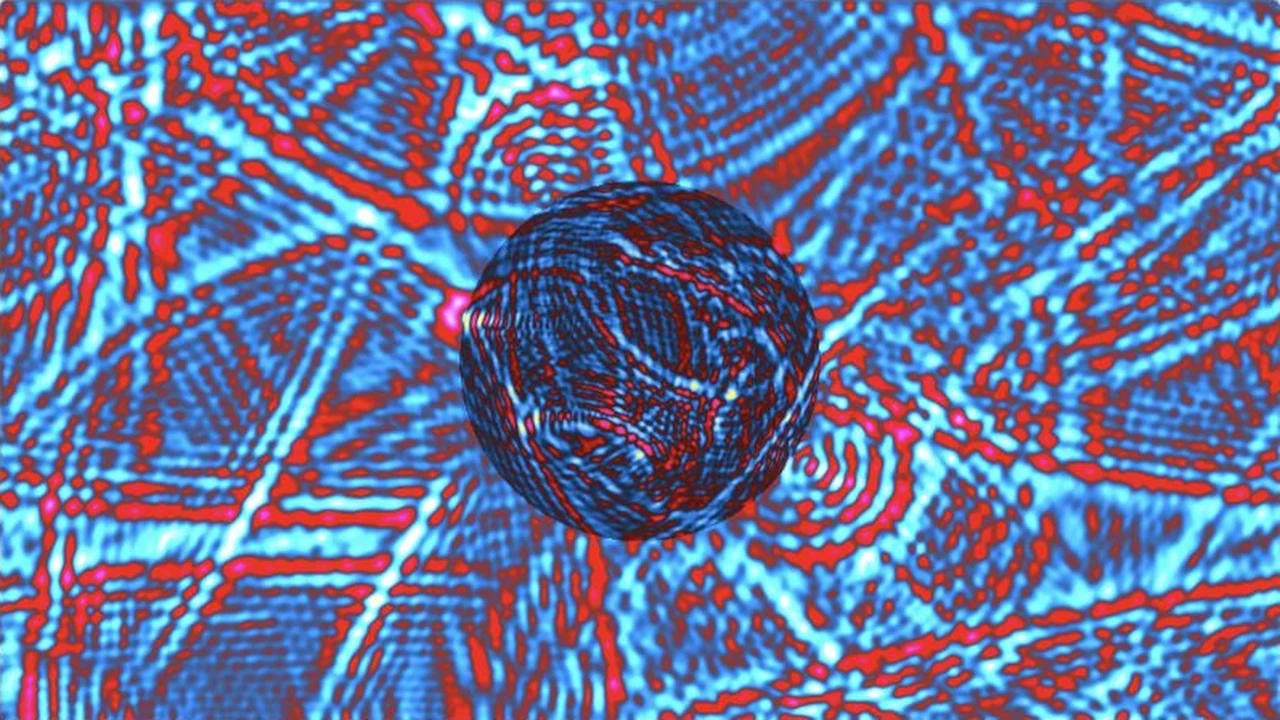 Red and cyan wavefronts interfere around a circular refractive region.